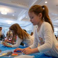 Girls decorate Christmas cookies